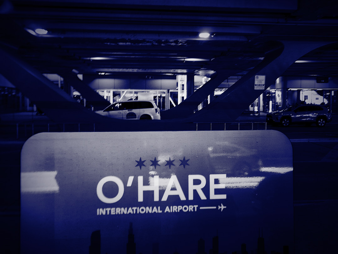 An O'Hare International Airport sign at night